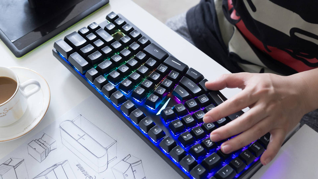 X-Bows Knight mechanical ergonomic keyboard on a professional office desk. Close-up of hands typing on the radial-columnar layout with RGB backlighting, demonstrating the natural wrist position for professionals.