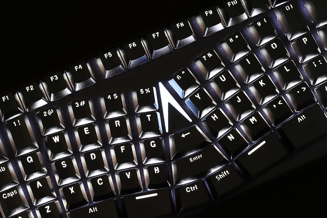 Close-up of  the X-BOWS Lite ergonomic keyboard with white backlighting